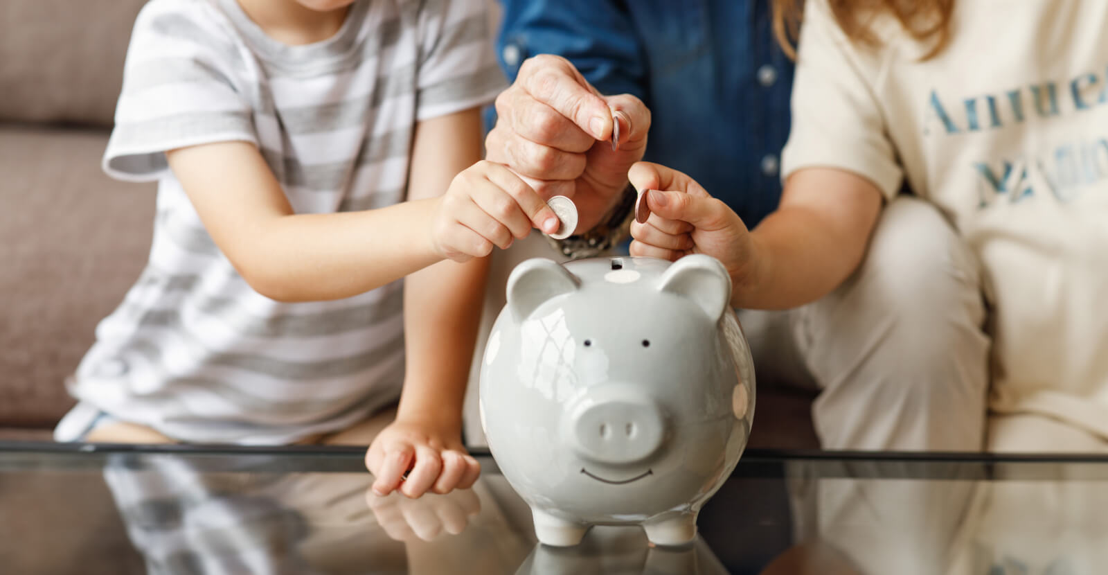 Grandfather and grandchildren saving money